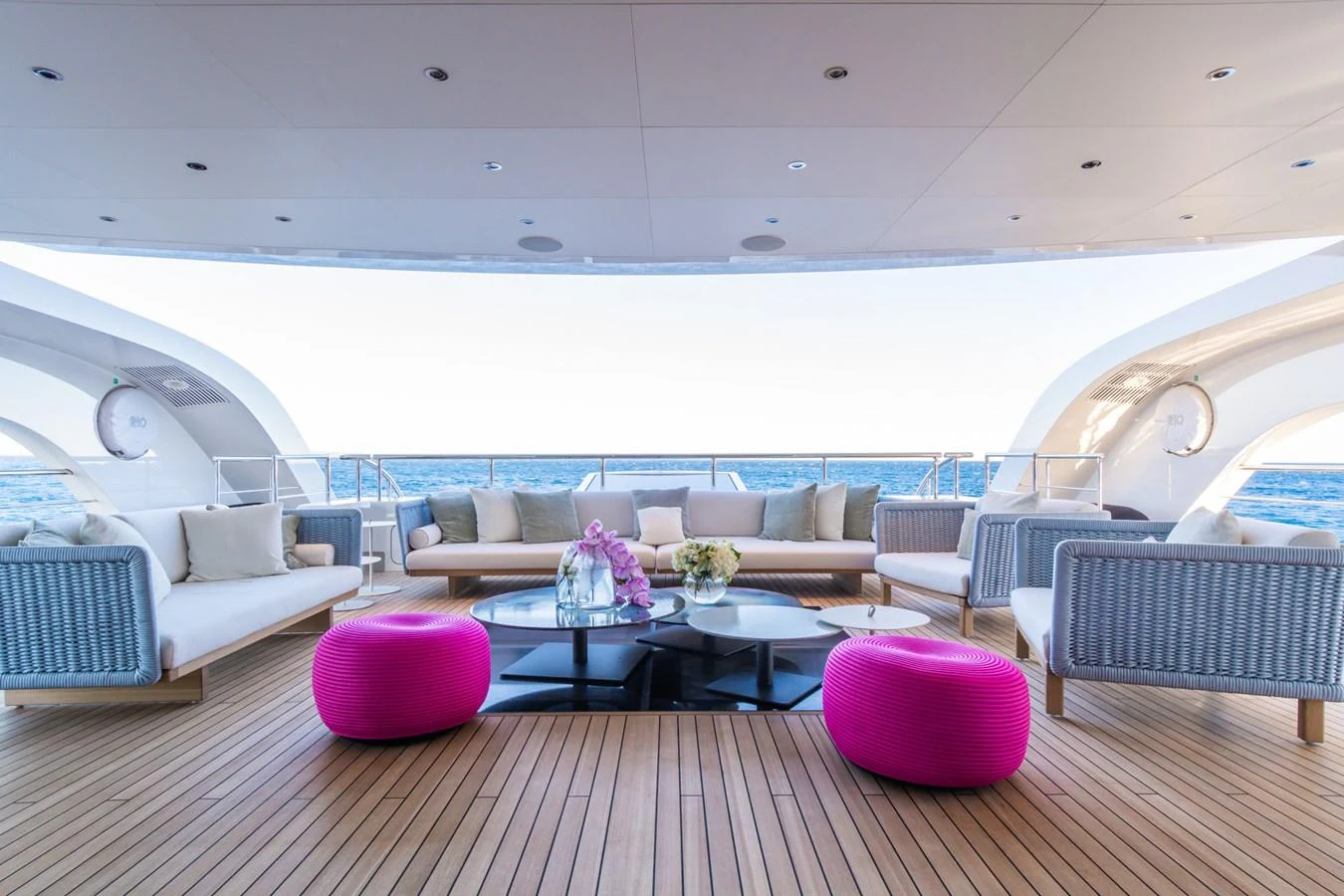 The aft deck features a spacious and stylish seating area with a stunning ocean view. aboard RIO Yacht for Sale