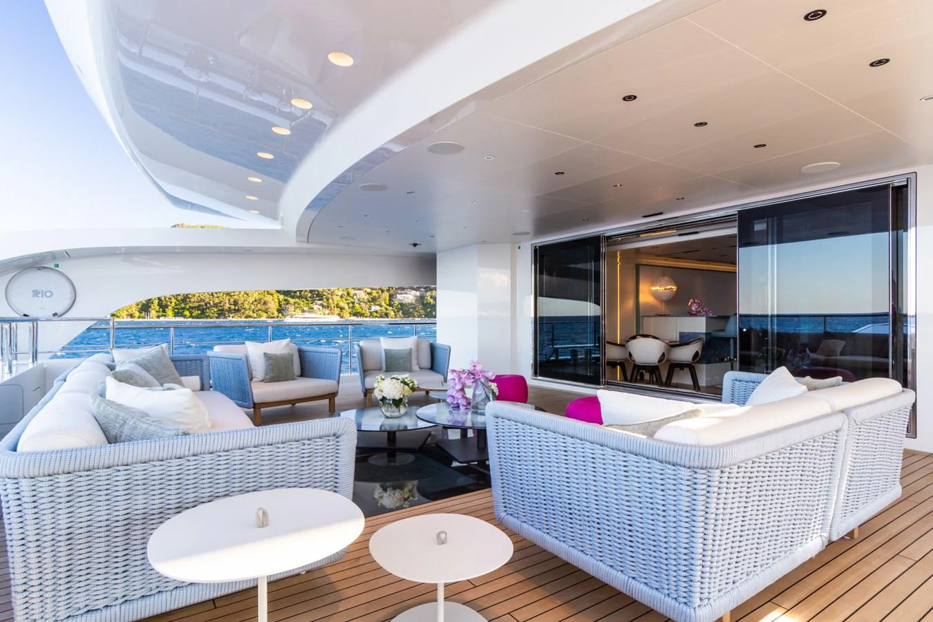 The aft deck offers a spacious and elegant outdoor seating area with stunning ocean views. aboard RIO Yacht for Sale