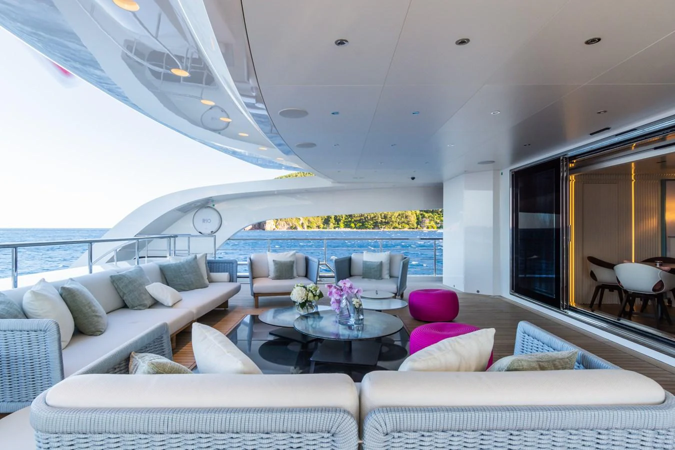 The aft deck offers a luxurious outdoor seating area with stunning ocean views. aboard RIO Yacht for Sale