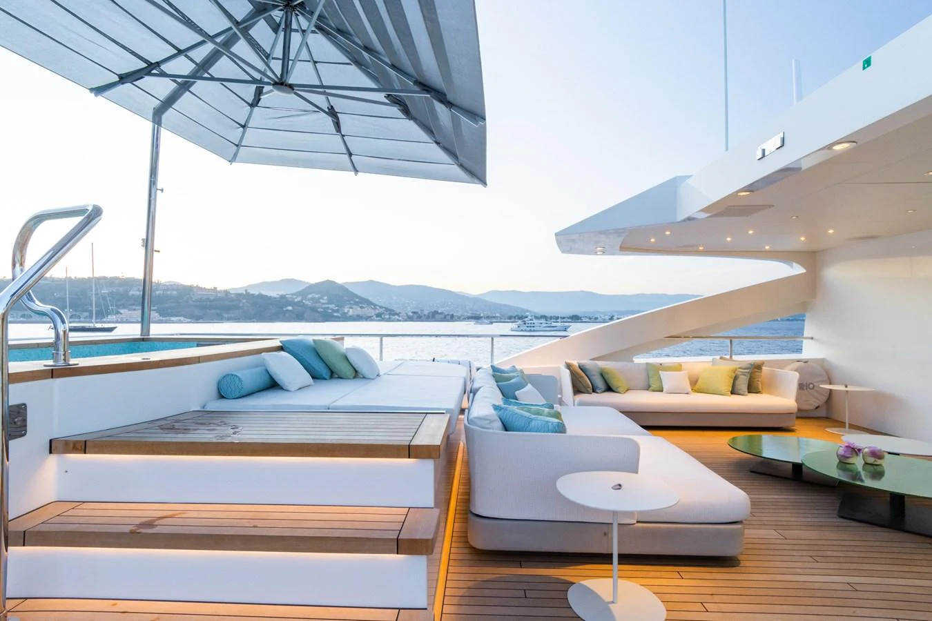 The sundeck offers a luxurious lounging area with comfortable seating and a shaded sunbathing spot, perfect for relaxation. aboard RIO Yacht for Sale