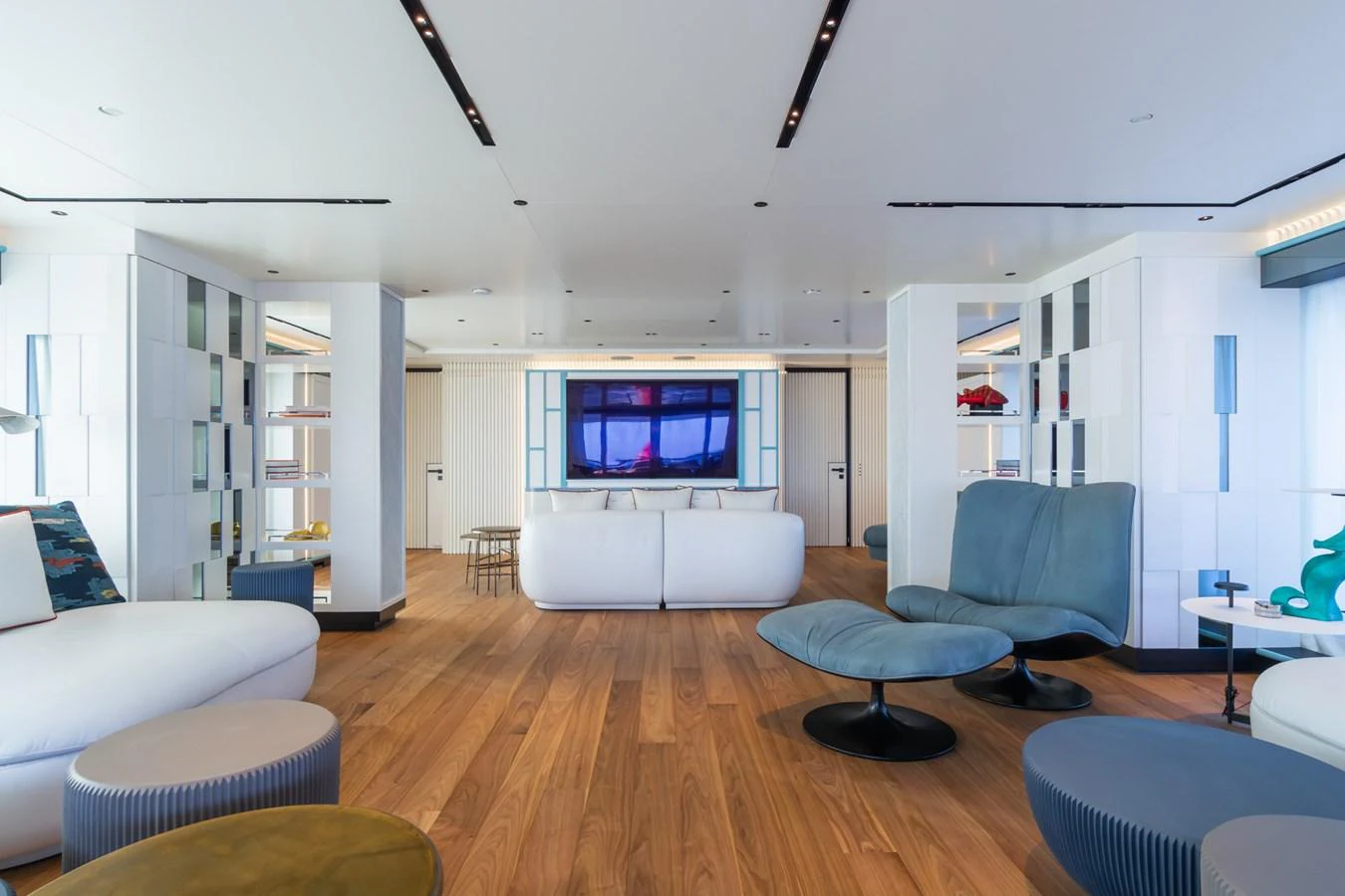 The spacious salon features modern furnishings and a large flat-screen TV, creating a comfortable and stylish living area. aboard RIO Yacht for Sale