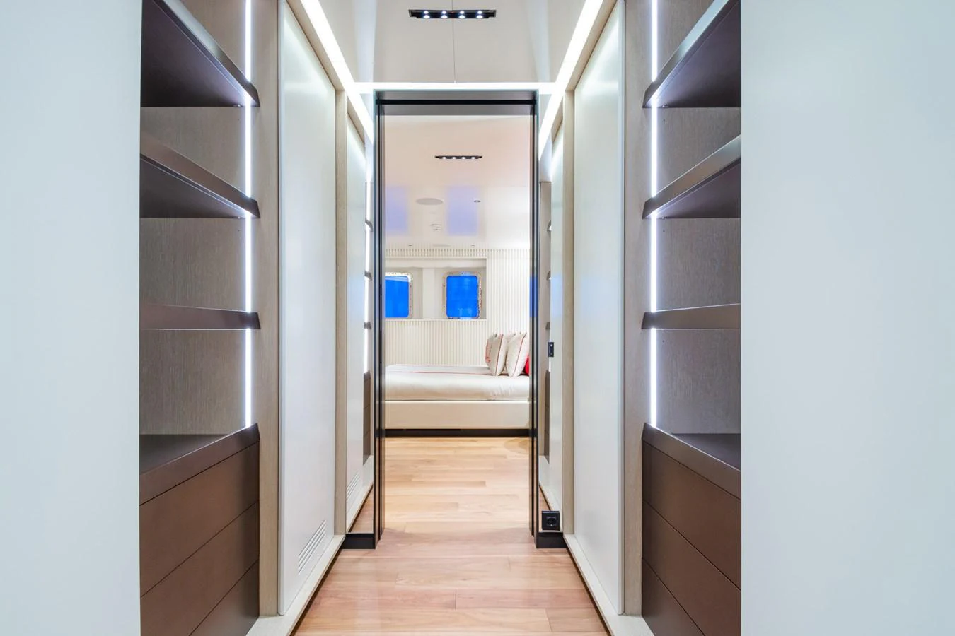 A sleek and modern hallway leading to a luxurious stateroom. aboard RIO Yacht for Sale