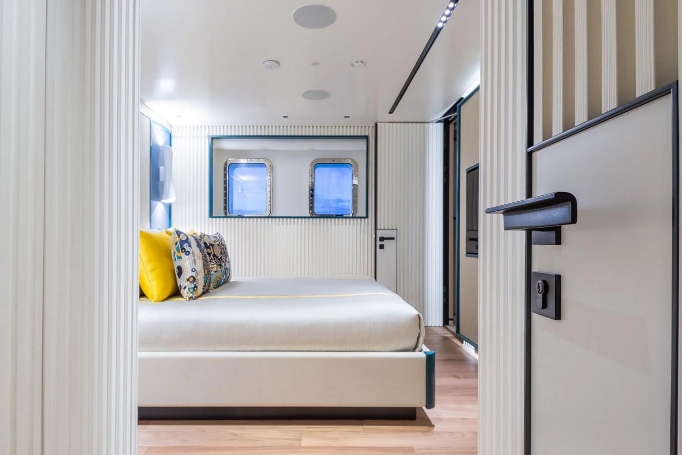 The stateroom features a modern design with a comfortable bed and large windows for natural light. aboard RIO Yacht for Sale