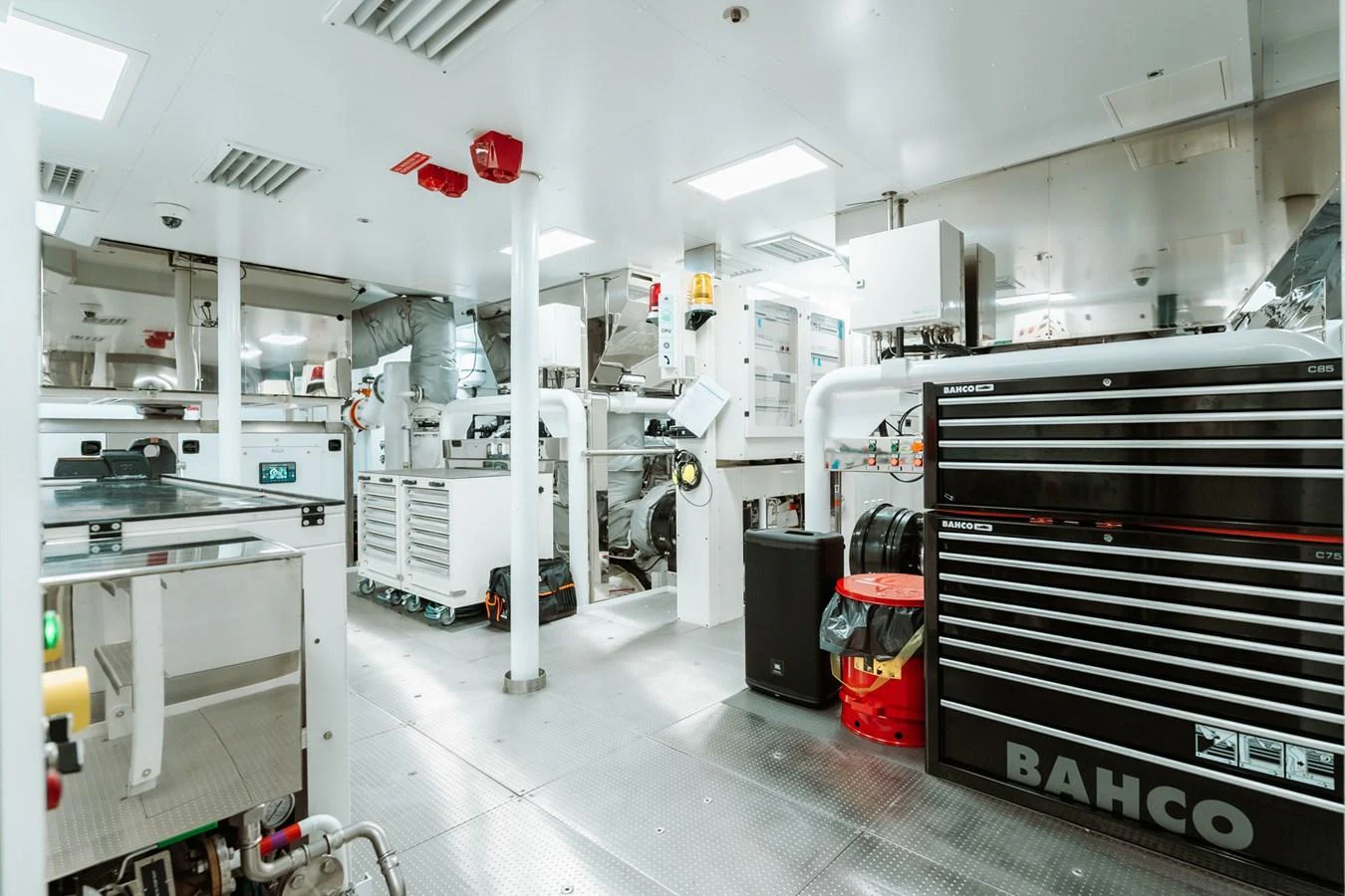 The engine room is equipped with advanced machinery and tools, showcasing a well-organized and high-tech environment. aboard RIO Yacht for Sale