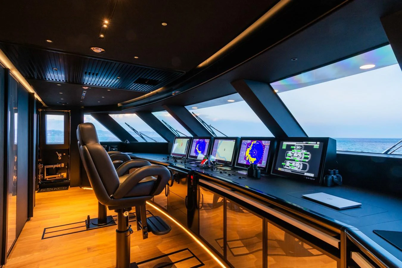 The helm station features state-of-the-art navigation equipment and a sleek, modern design. aboard RIO Yacht for Sale