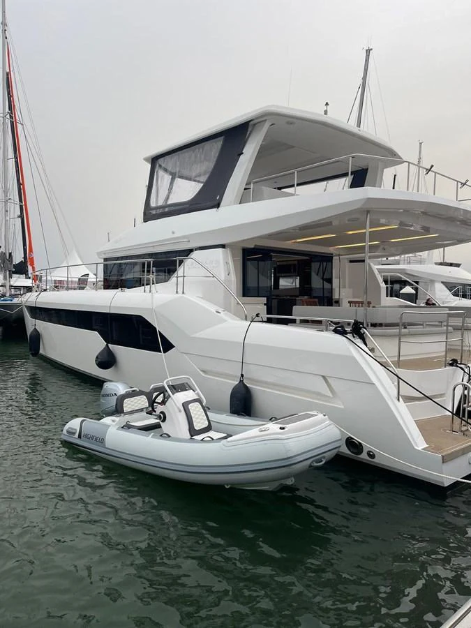 A sleek yacht is docked at the marina, showcasing its modern design and spacious upper deck. aboard LEOPARD 28M Yacht for Sale