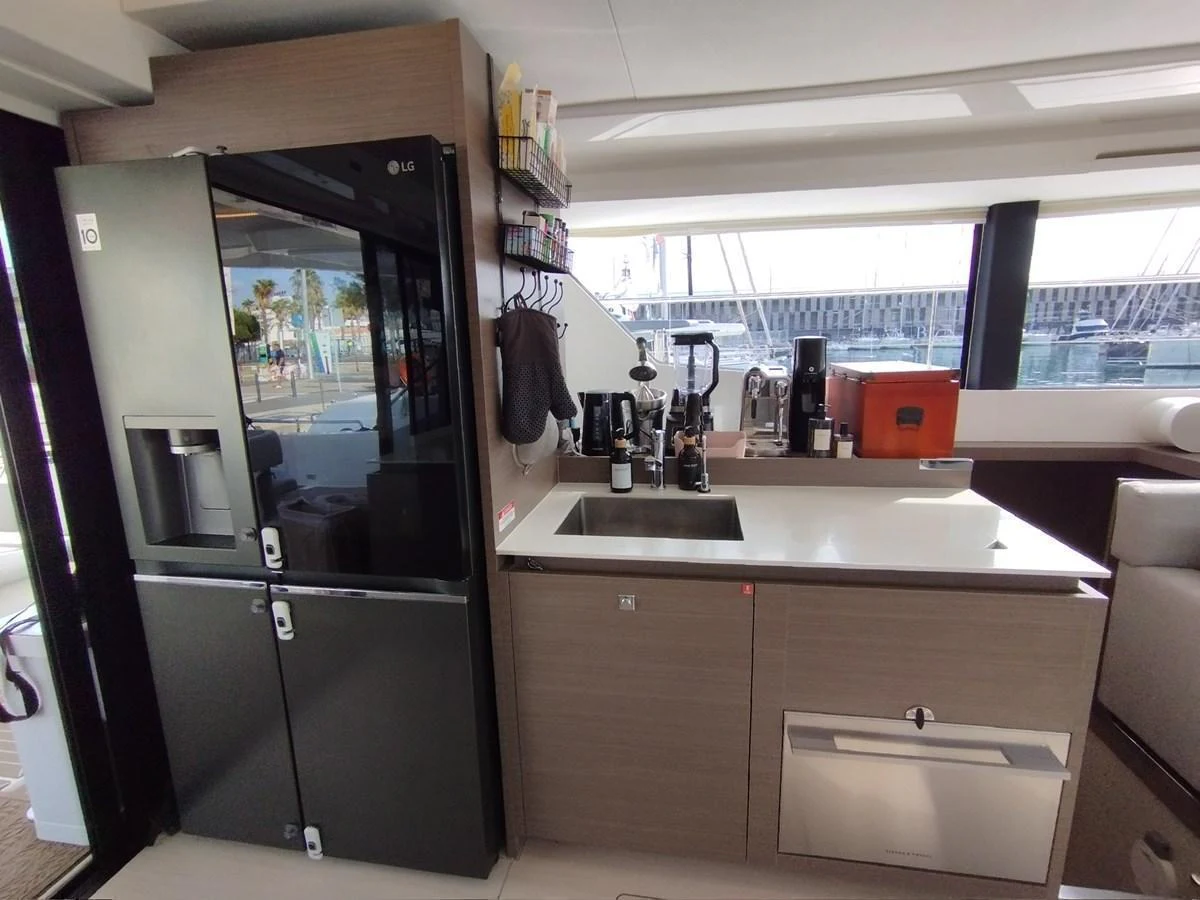 The yacht's galley is equipped with modern appliances and ample counter space for meal preparation. aboard LEOPARD 28M Yacht for Sale