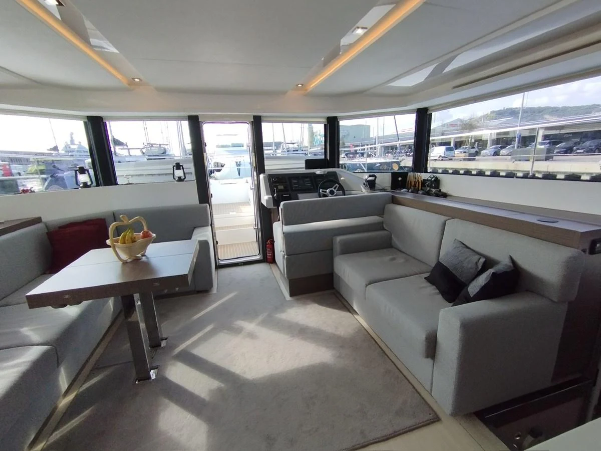 The salon features comfortable seating and a dining area with ample natural light. aboard LEOPARD 28M Yacht for Sale