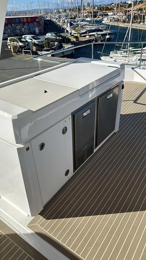 A close-up view of a yacht's deck area featuring built-in storage units. aboard LEOPARD 28M Yacht for Sale