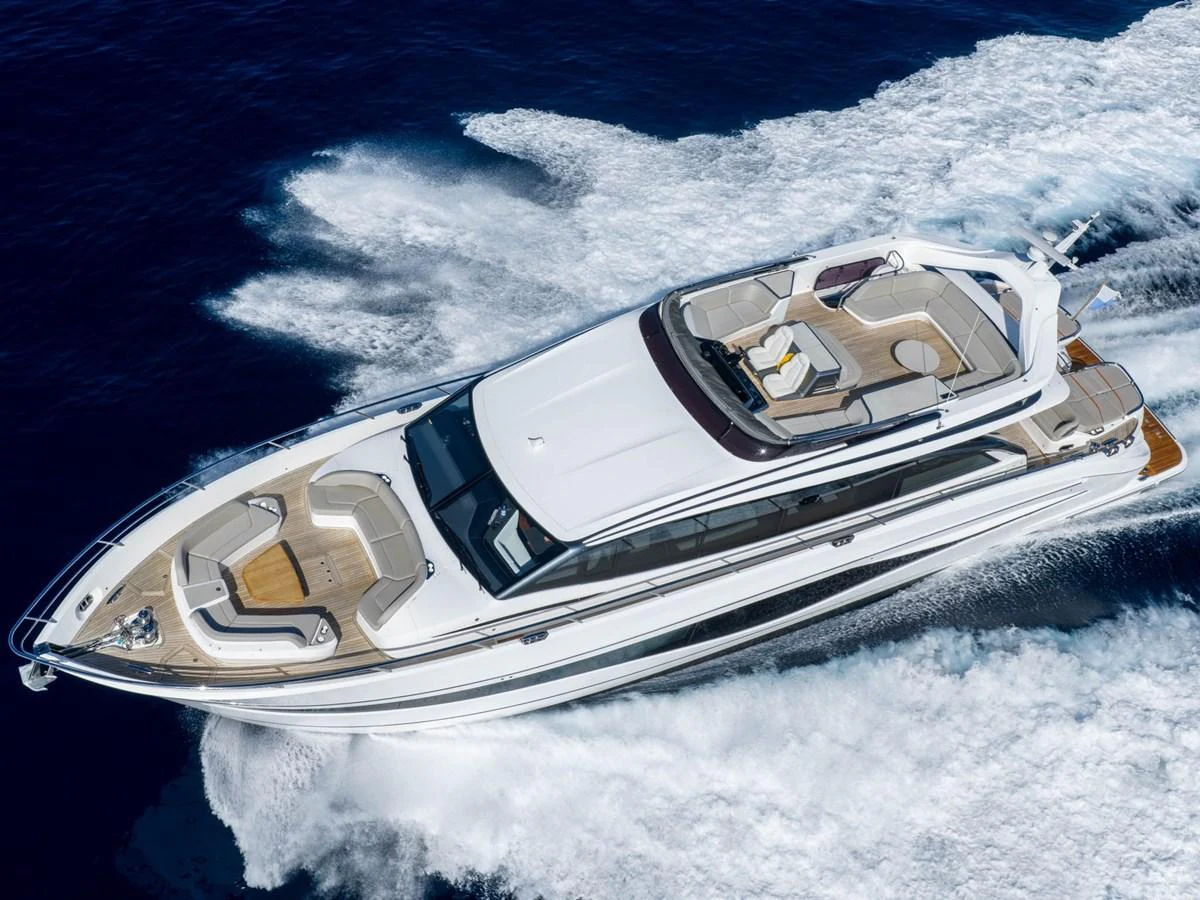 a white car on a snowy mountain aboard PRINCESS S80 Yacht for Sale