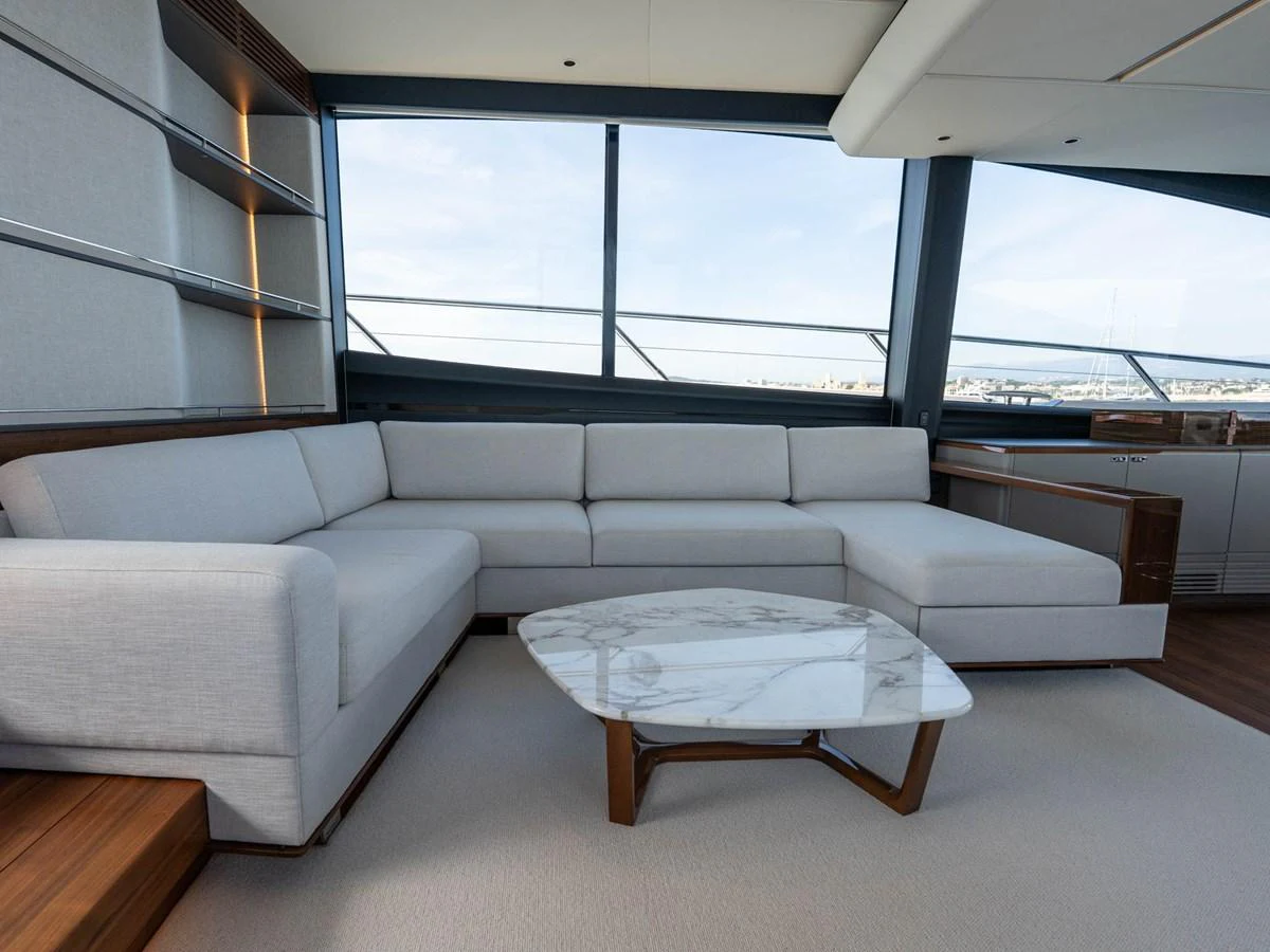 a living room with a large window aboard PRINCESS S80 Yacht for Sale
