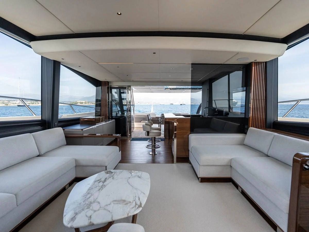 a living room with a large window aboard PRINCESS S80 Yacht for Sale