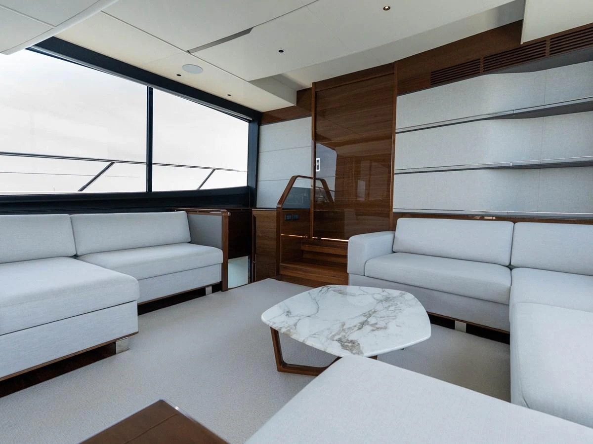 a room with a couch and a table aboard PRINCESS S80 Yacht for Sale