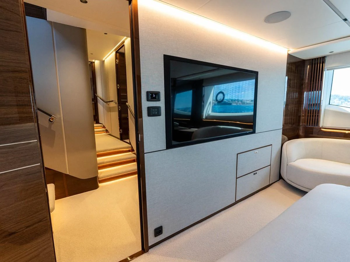 a room with a tv and a couch aboard PRINCESS S80 Yacht for Sale