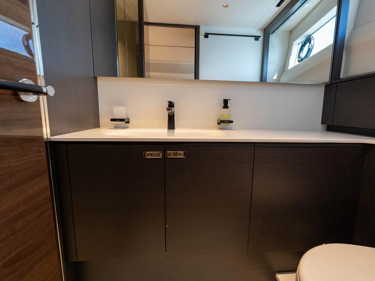 a kitchen with a sink and cabinets aboard PRINCESS S80 Yacht for Sale