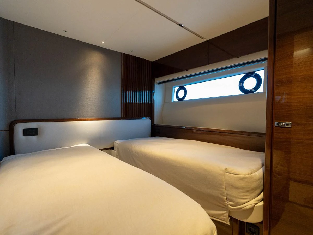 a room with two beds aboard PRINCESS S80 Yacht for Sale