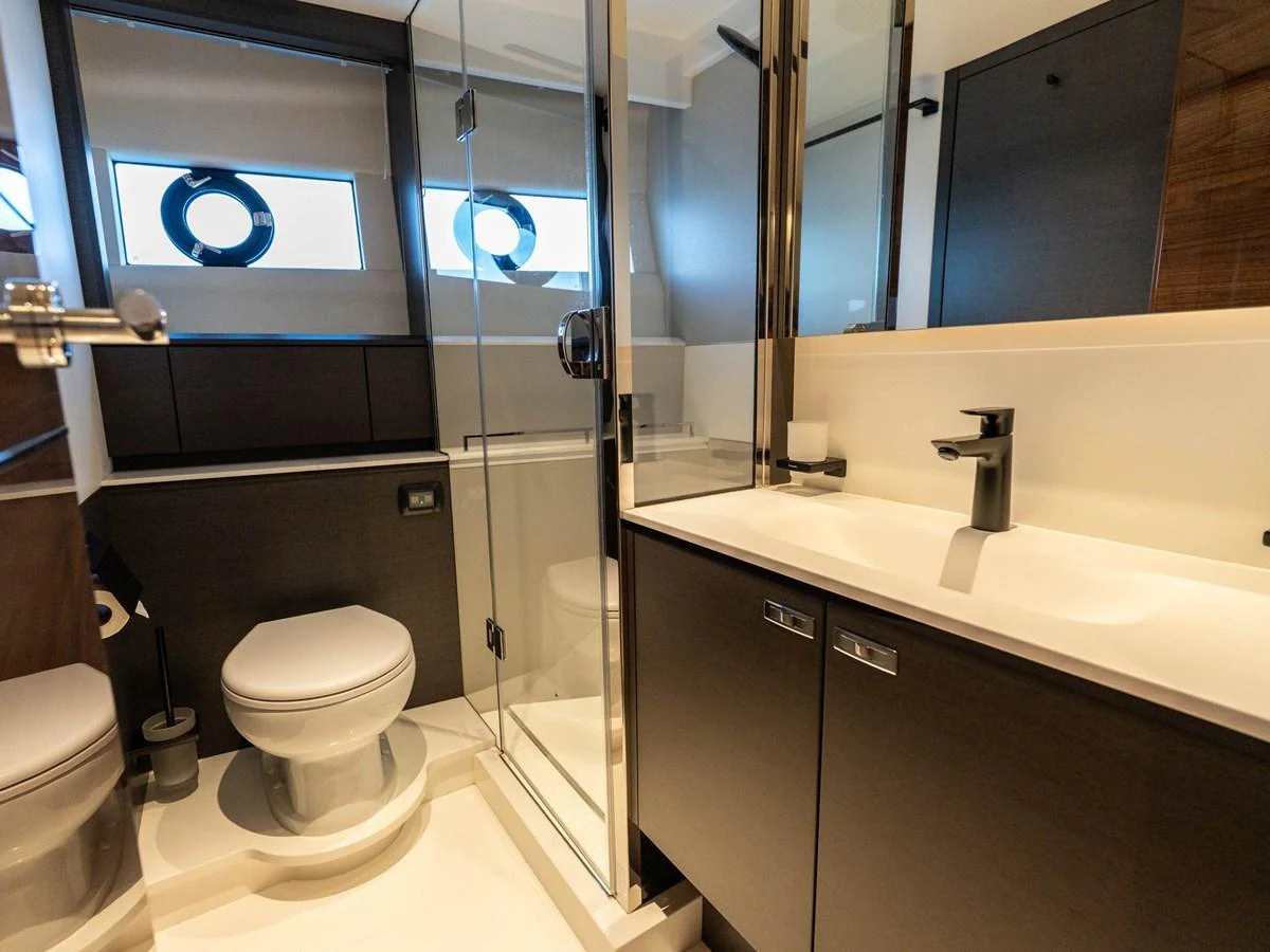 a bathroom with a glass shower aboard PRINCESS S80 Yacht for Sale