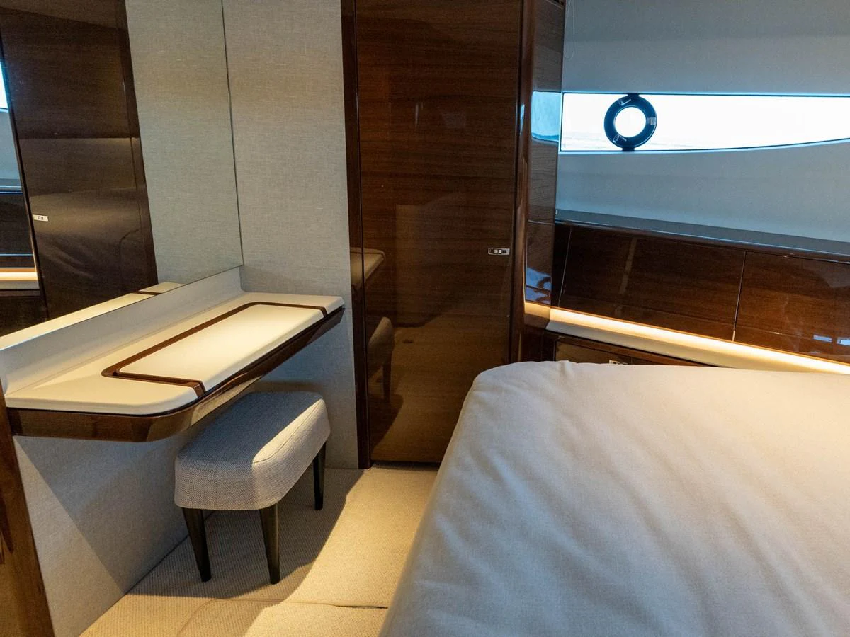 a bed next to a desk aboard PRINCESS S80 Yacht for Sale