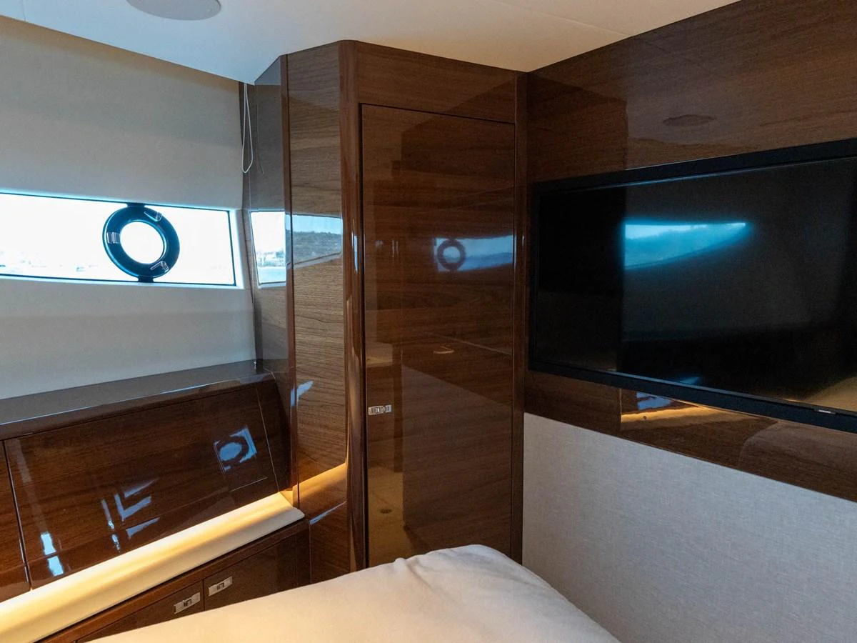 a room with a bed and a tv aboard PRINCESS S80 Yacht for Sale