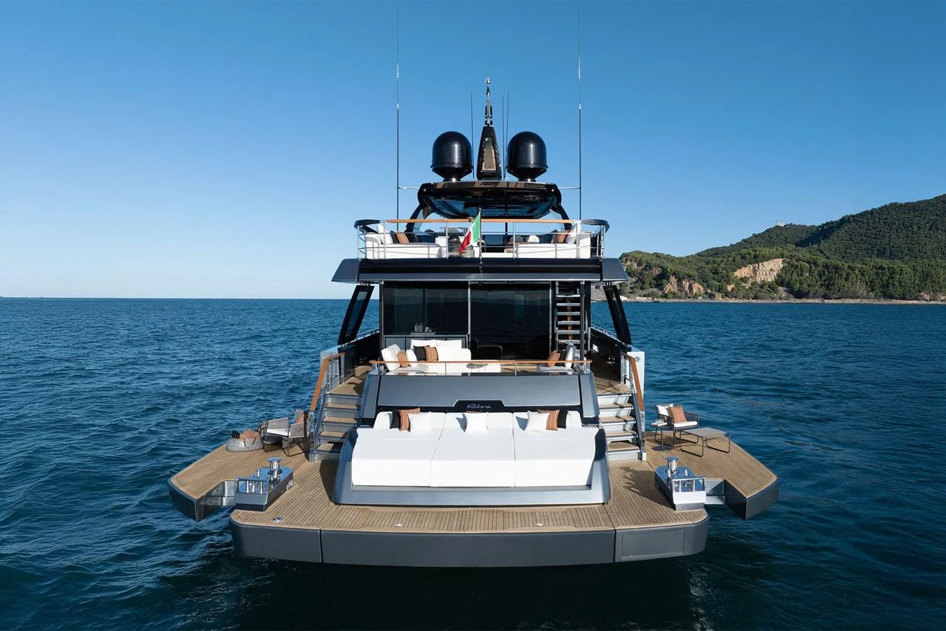 The yacht's aft deck features a spacious lounging area with direct access to the water. aboard RIVA 112 DOLCEVITA SUPER Yacht for Sale