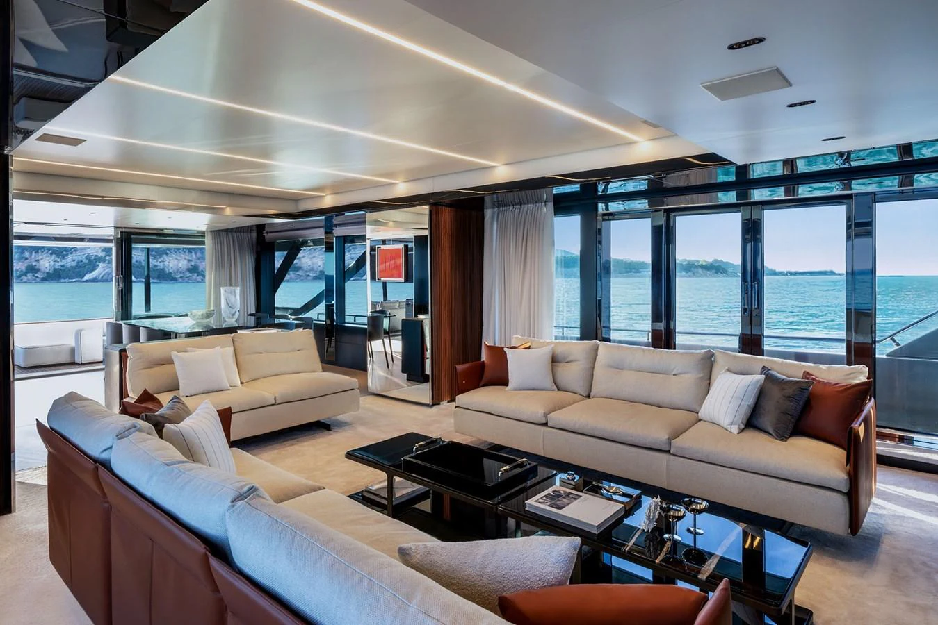 The salon offers a spacious and luxurious seating area with panoramic views of the sea. aboard RIVA 112 DOLCEVITA SUPER Yacht for Sale