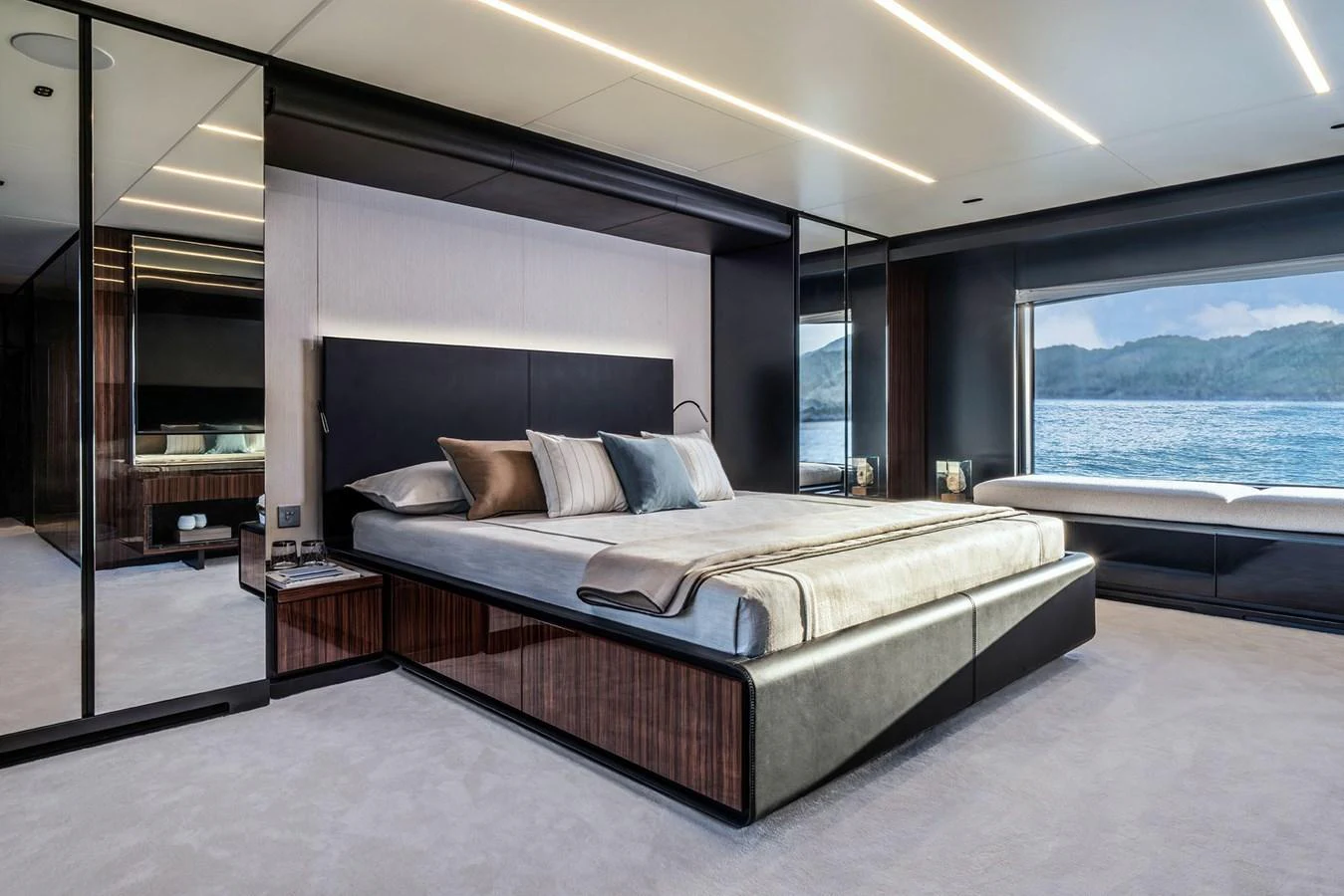 The master stateroom features a luxurious bed with a stunning view of the sea. aboard RIVA 112 DOLCEVITA SUPER Yacht for Sale