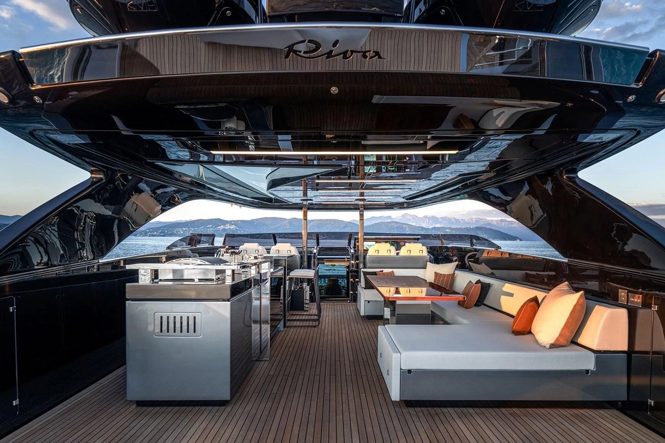 The aft deck features a luxurious outdoor lounge area with modern seating and a sleek design. aboard RIVA 112 DOLCEVITA SUPER Yacht for Sale