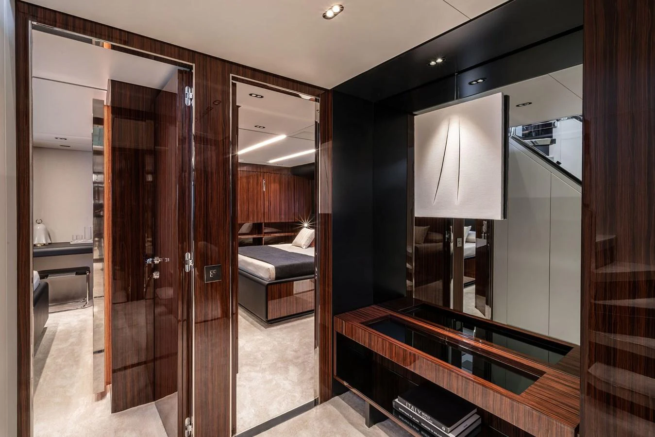 The yacht's interior features a modern and luxurious design with high-gloss wood finishes and contemporary decor. aboard RIVA 112 DOLCEVITA SUPER Yacht for Sale