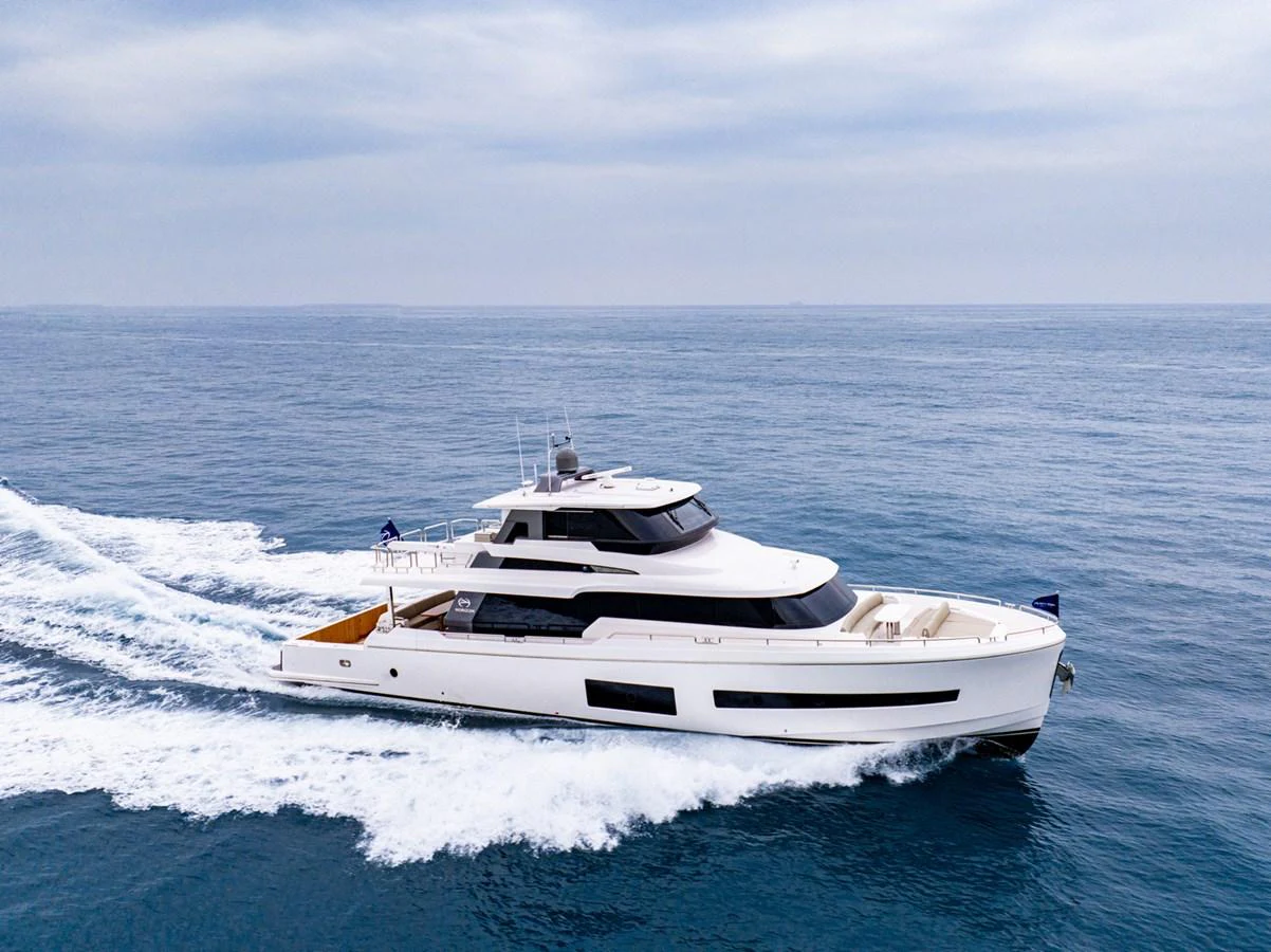 a white yacht in the water aboard HORIZON V77S Yacht for Sale