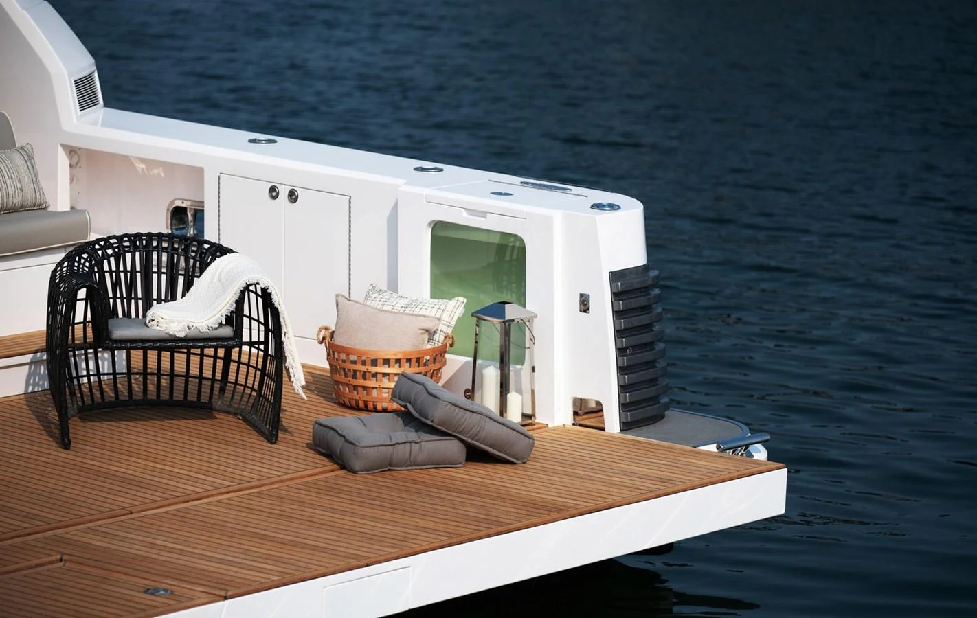 a table with a chair and a computer on it aboard HORIZON V77S Yacht for Sale