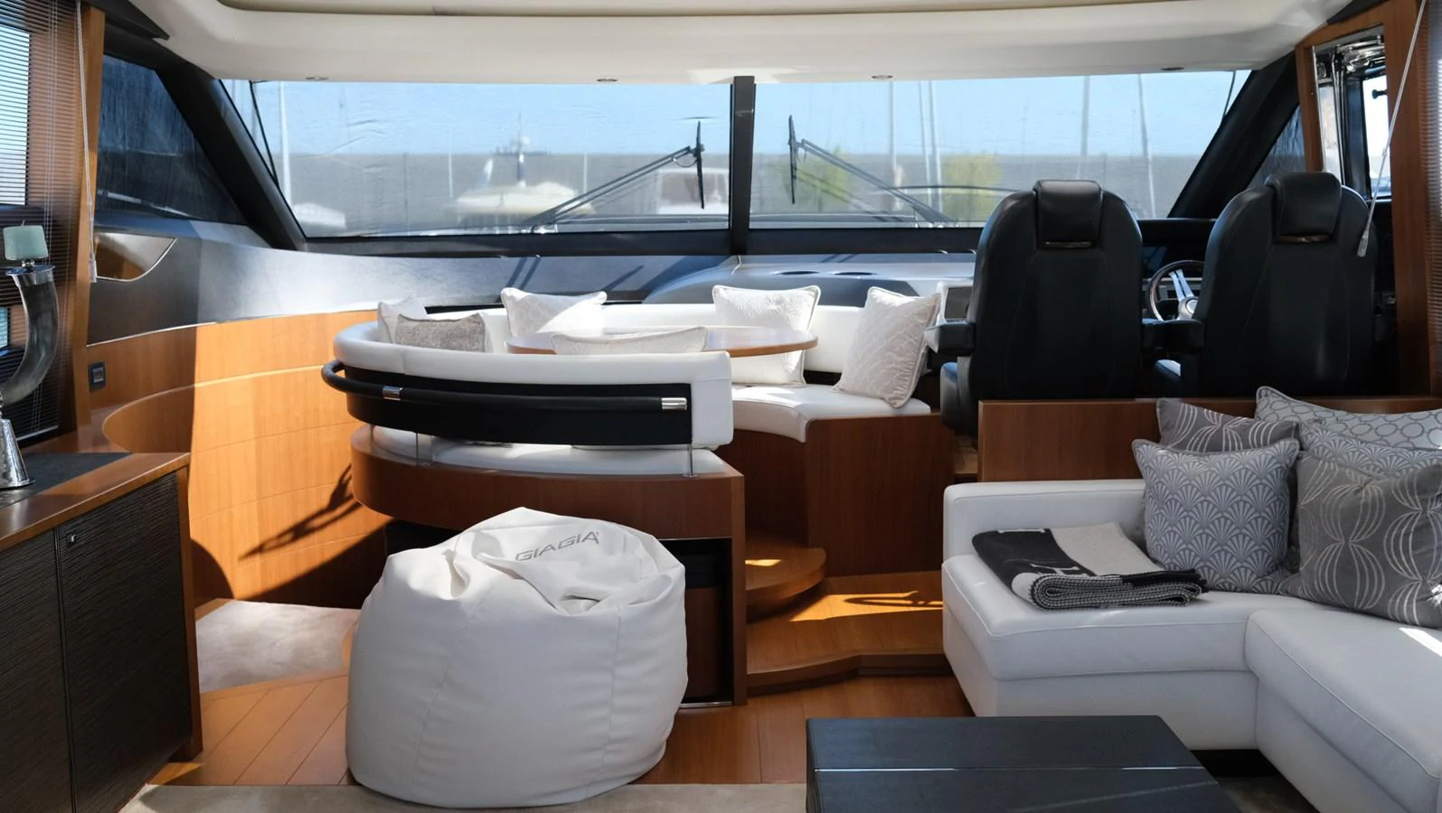 The salon features plush seating, a modern helm, and expansive windows for panoramic views. aboard GIA GIA' Yacht for Sale