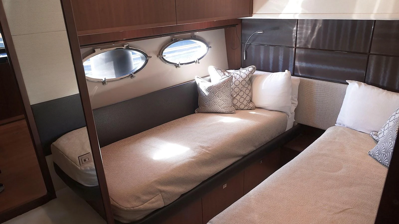 The guest stateroom features twin beds with elegant bedding and natural light from portholes. aboard GIA GIA' Yacht for Sale