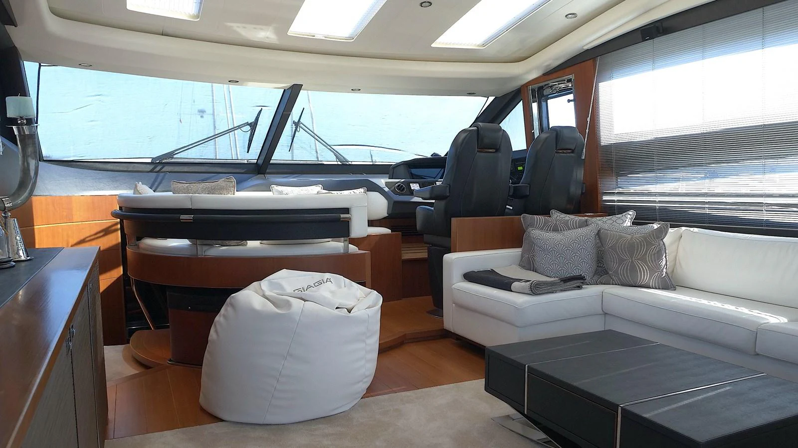 The salon features a modern and spacious seating area with ample natural light. aboard GIA GIA' Yacht for Sale