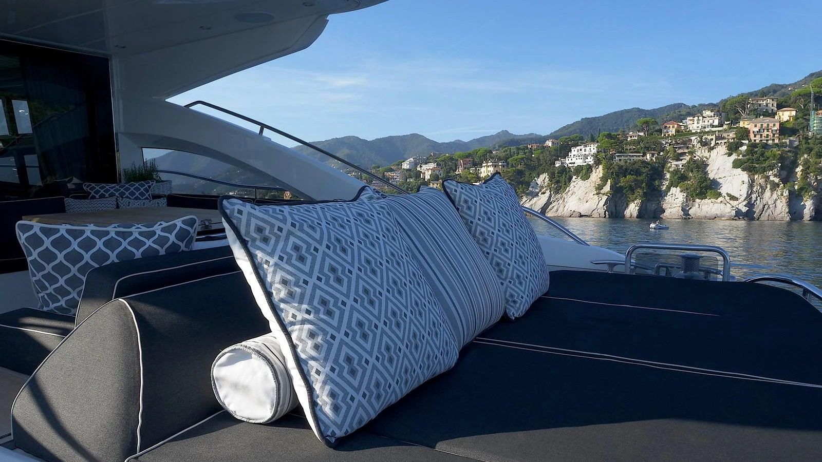 The sundeck offers a luxurious lounging area with plush cushions and scenic views. aboard GIA GIA' Yacht for Sale