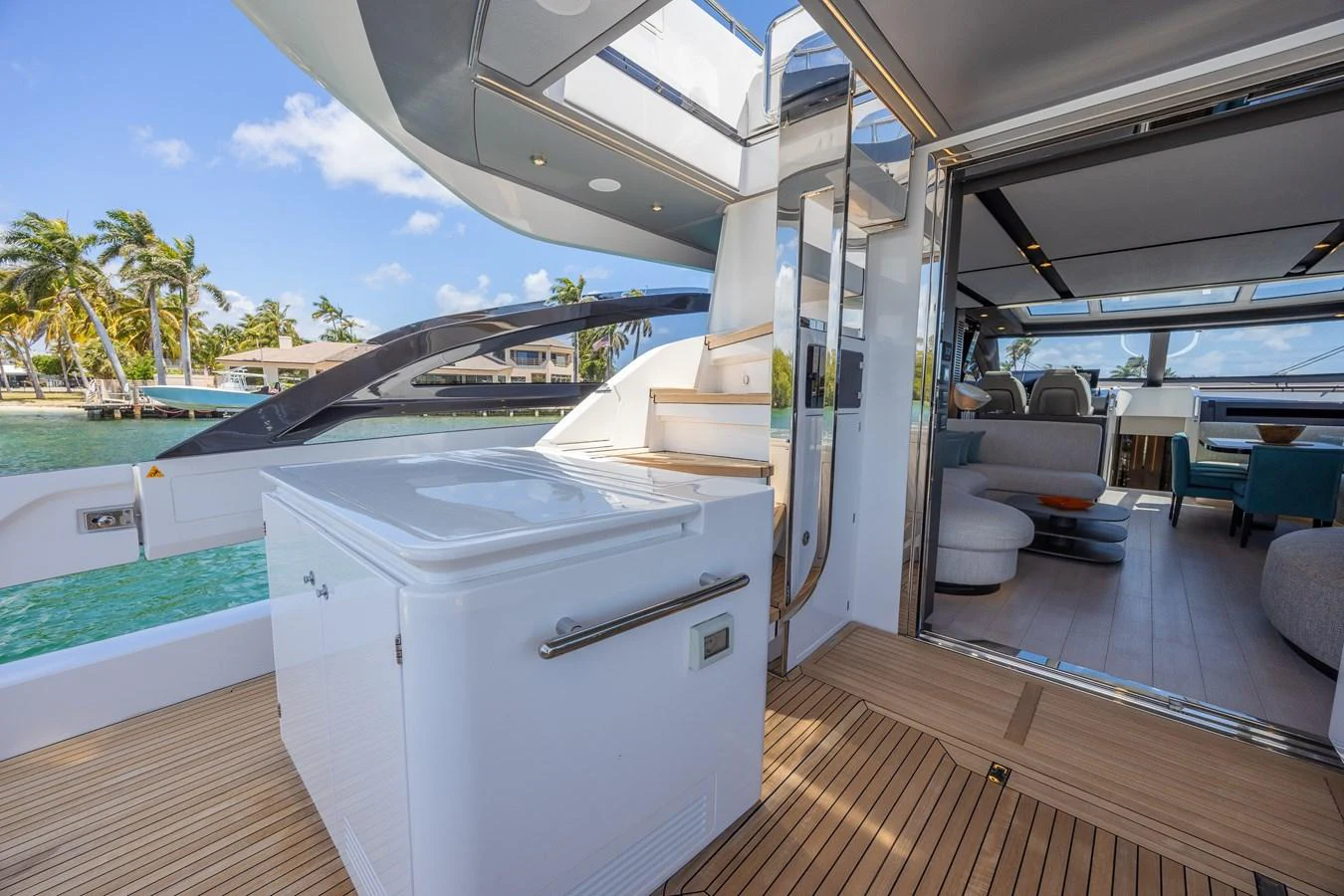 The aft deck offers a seamless transition between indoor and outdoor living with luxurious amenities and stunning views. aboard NO TIME TO DIE Yacht for Sale