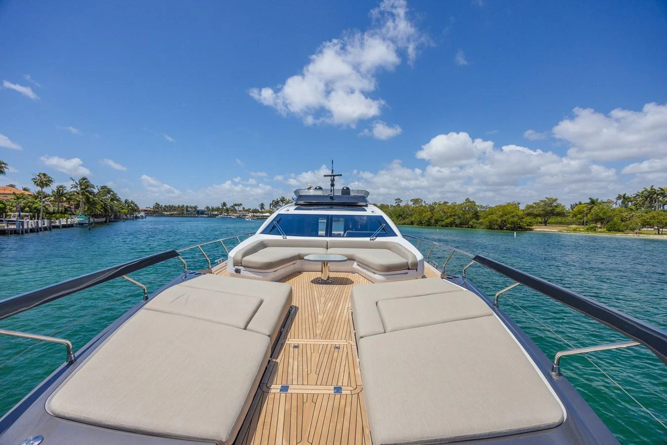The foredeck of the yacht features spacious sun pads and a comfortable seating area, perfect for relaxation. aboard NO TIME TO DIE Yacht for Sale