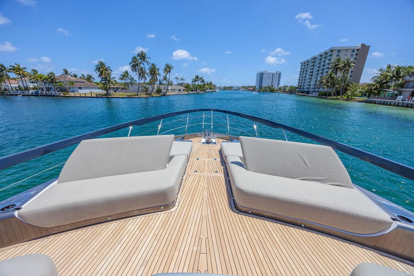The foredeck features spacious sun loungers with a stunning view of the water and surrounding scenery. aboard NO TIME TO DIE Yacht for Sale