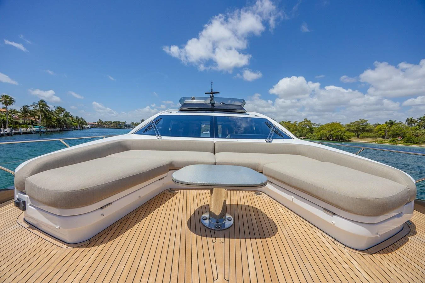 The foredeck features a spacious seating area with a central table, perfect for enjoying the view. aboard NO TIME TO DIE Yacht for Sale