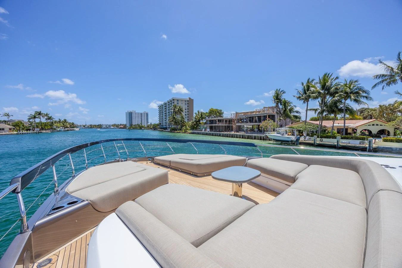 The yacht's foredeck offers spacious sun pads with a stunning waterfront view. aboard NO TIME TO DIE Yacht for Sale