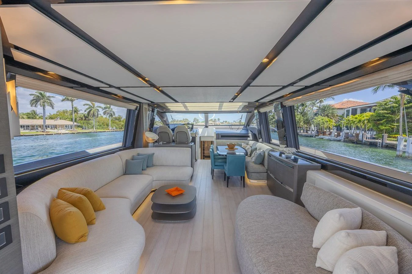 The spacious salon offers a luxurious and comfortable seating area with panoramic views. aboard NO TIME TO DIE Yacht for Sale