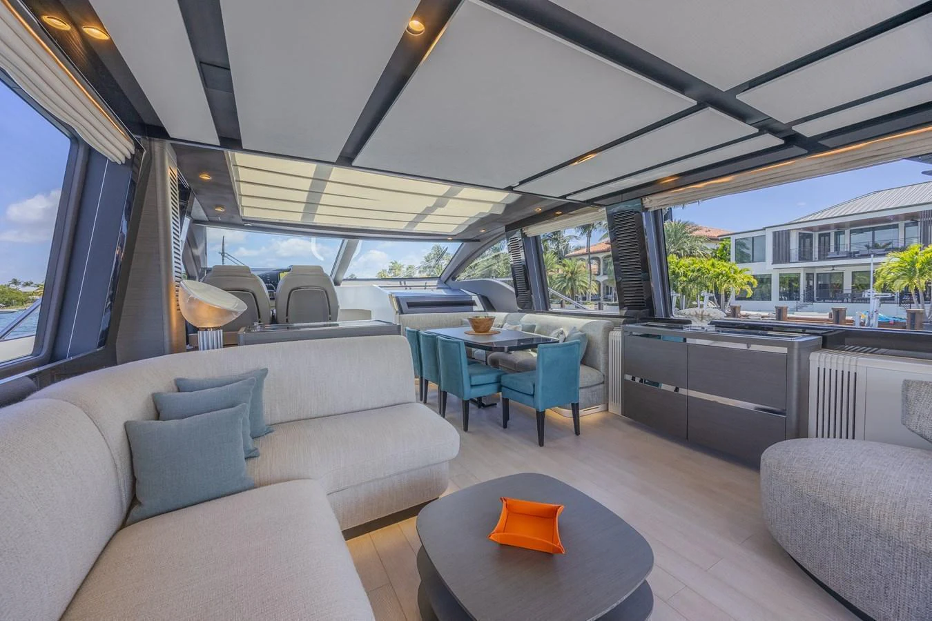 The yacht's salon features a spacious and modern design with ample seating and natural light. aboard NO TIME TO DIE Yacht for Sale
