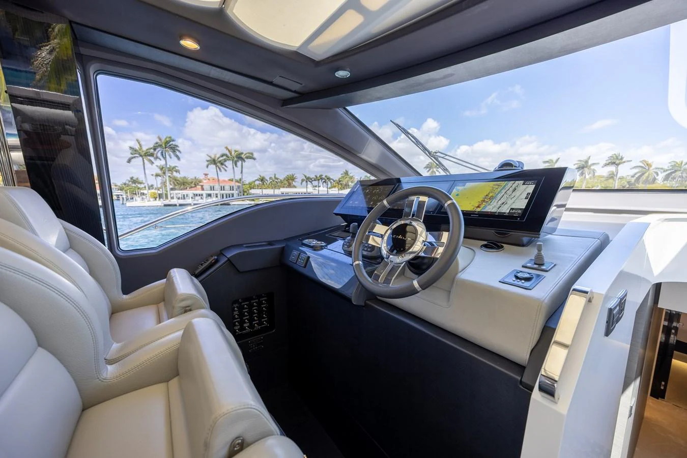 The helm station offers a sleek and modern design with advanced navigation equipment and comfortable seating. aboard NO TIME TO DIE Yacht for Sale