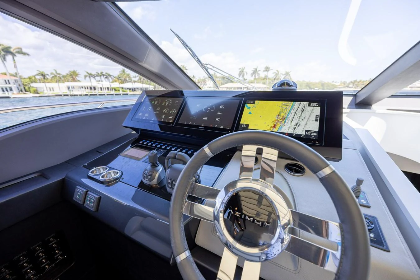 The helm station features advanced navigation equipment and a sleek steering wheel, offering a commanding view of the surroundings. aboard NO TIME TO DIE Yacht for Sale