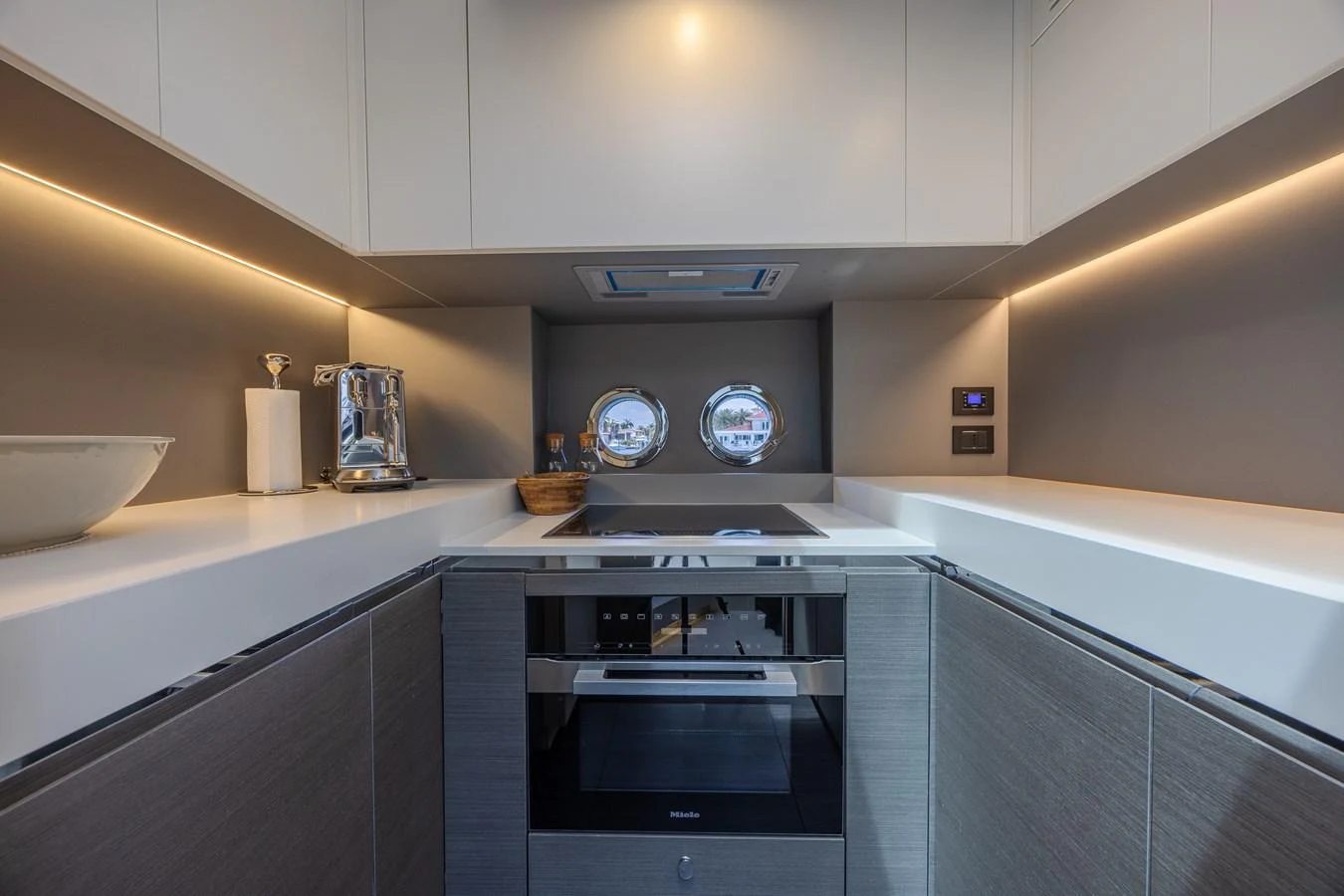The yacht's galley is sleek and modern, featuring high-end appliances and ample counter space. aboard NO TIME TO DIE Yacht for Sale