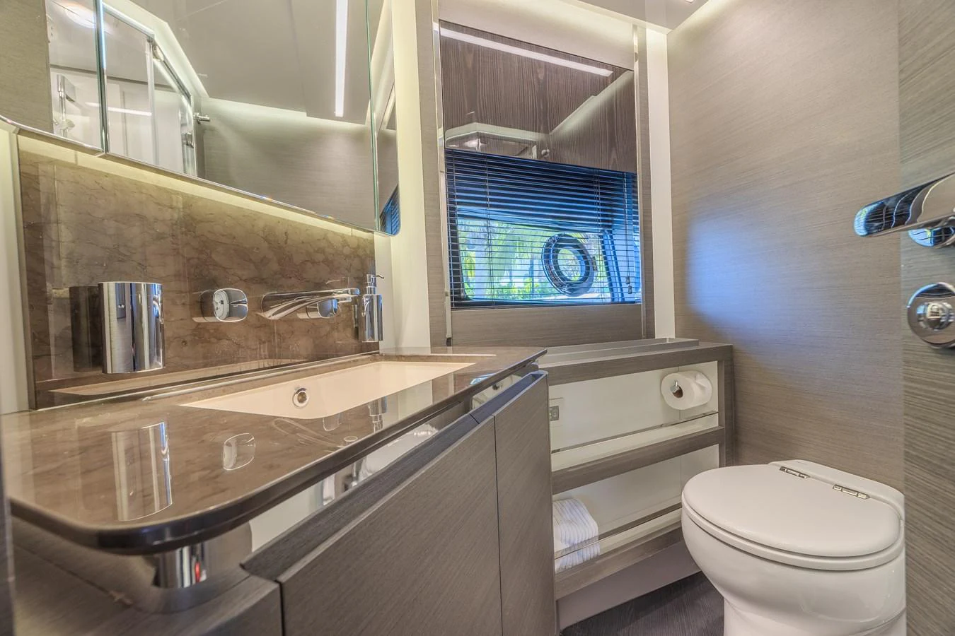 The yacht's bathroom features modern fixtures and a sleek design. aboard NO TIME TO DIE Yacht for Sale