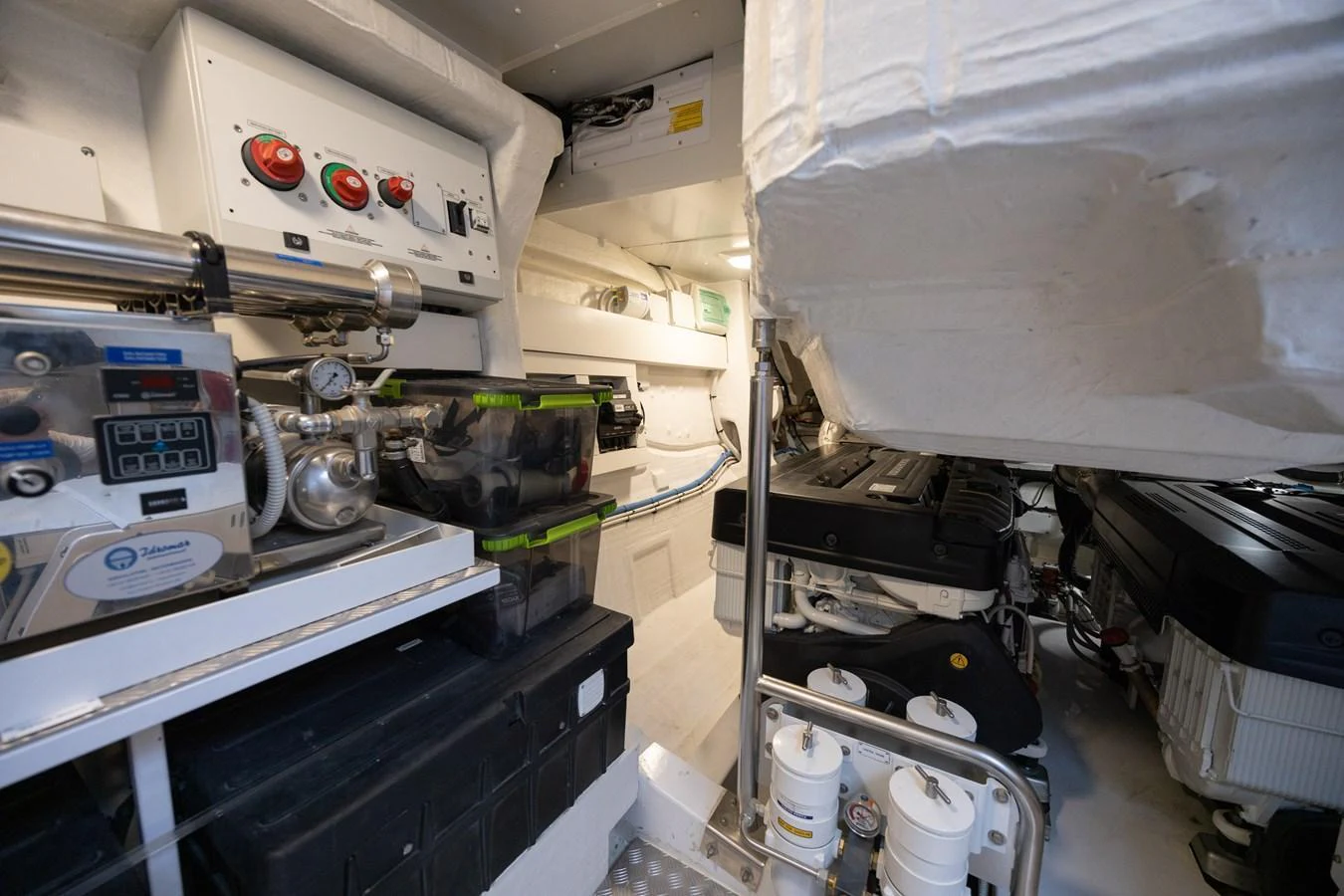 The image showcases the well-organized engine room with advanced machinery and equipment. aboard NO TIME TO DIE Yacht for Sale