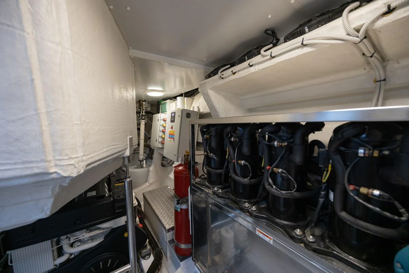 The image showcases the yacht's well-organized engine room with advanced machinery and equipment. aboard NO TIME TO DIE Yacht for Sale