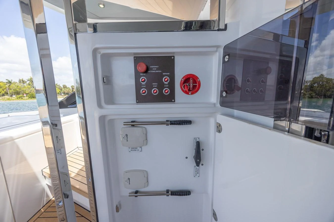 A detailed view of the yacht's control panel and storage area, showcasing its functionality and design. aboard NO TIME TO DIE Yacht for Sale