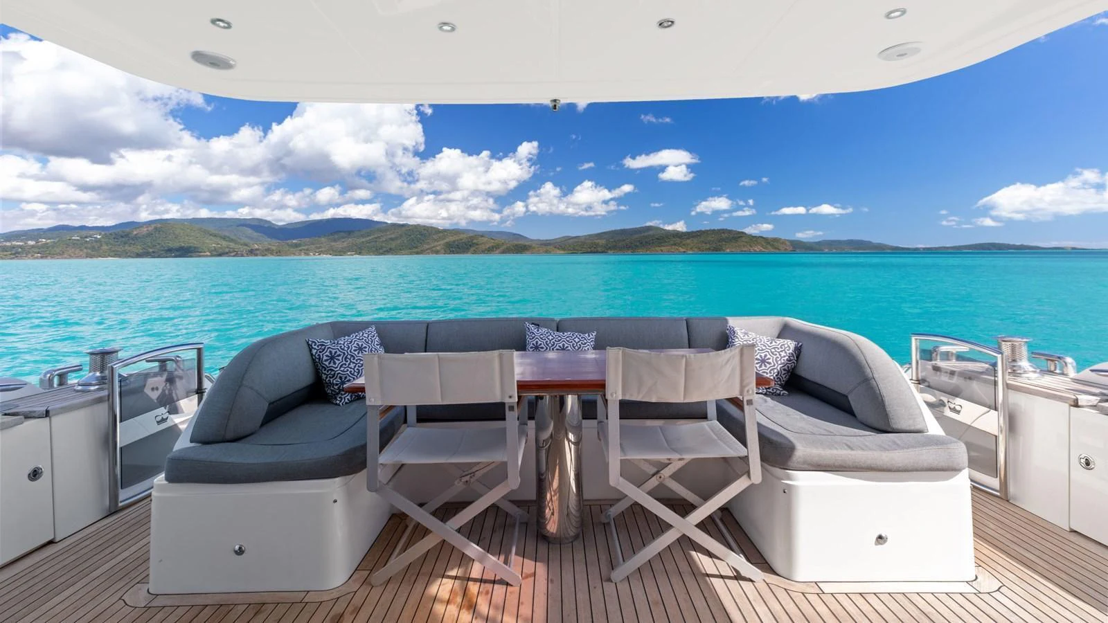 The aft deck features a comfortable seating area with stunning views of the surrounding waters. aboard ABOUT TIME Yacht for Sale