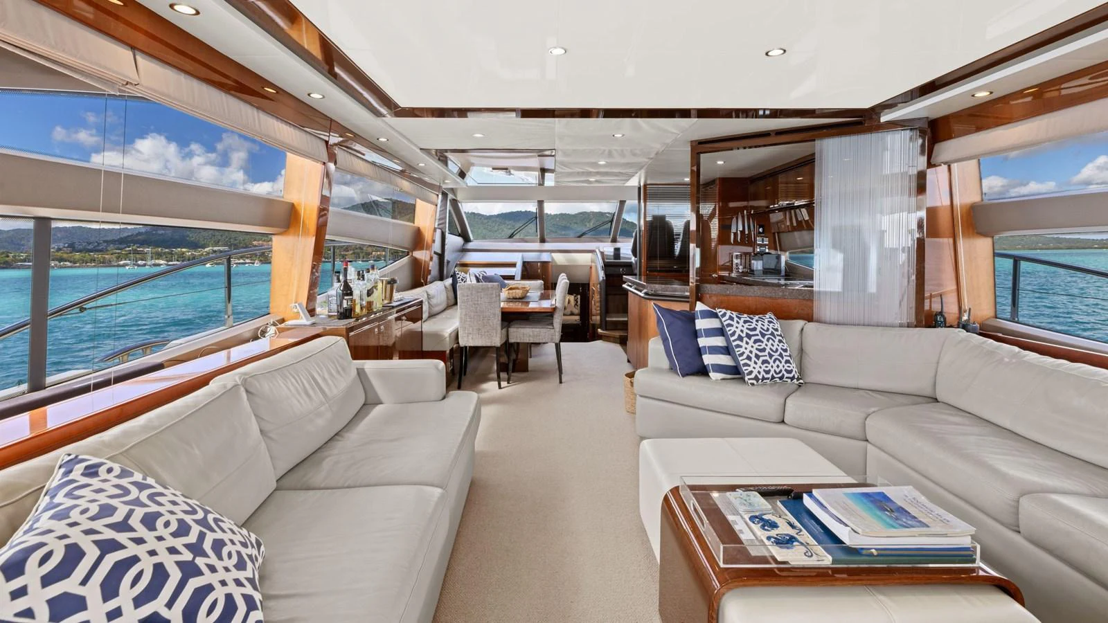 The spacious salon offers luxurious seating with panoramic views of the surrounding waters. aboard ABOUT TIME Yacht for Sale